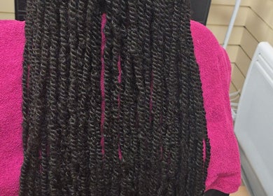 Detailed twisted braids hairstyle at Arty salon, Rochdale, England, GB, showcasing professional hair styling.