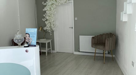 Serene reception at Rae’s Retreat Massage, St Helens, England, GB, featuring elegant decor and cozy seating.