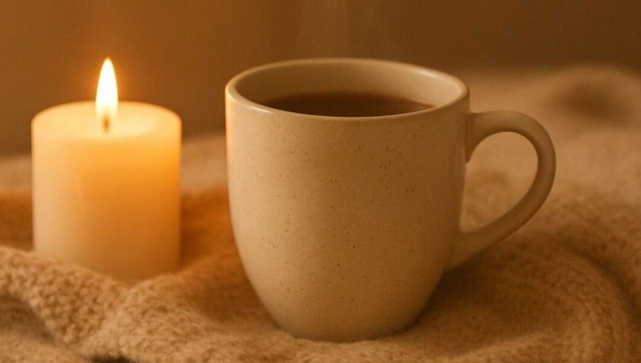 Warm tea and candlelight at Golden Light Reiki, Tickenham, Bristol, England, GB create a soothing ambiance.