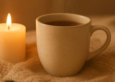 Warm tea and candlelight at Golden Light Reiki, Tickenham, Bristol, England, GB create a soothing ambiance.