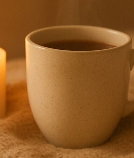Warm tea and candlelight at Golden Light Reiki, Tickenham, Bristol, England, GB create a soothing ambiance.