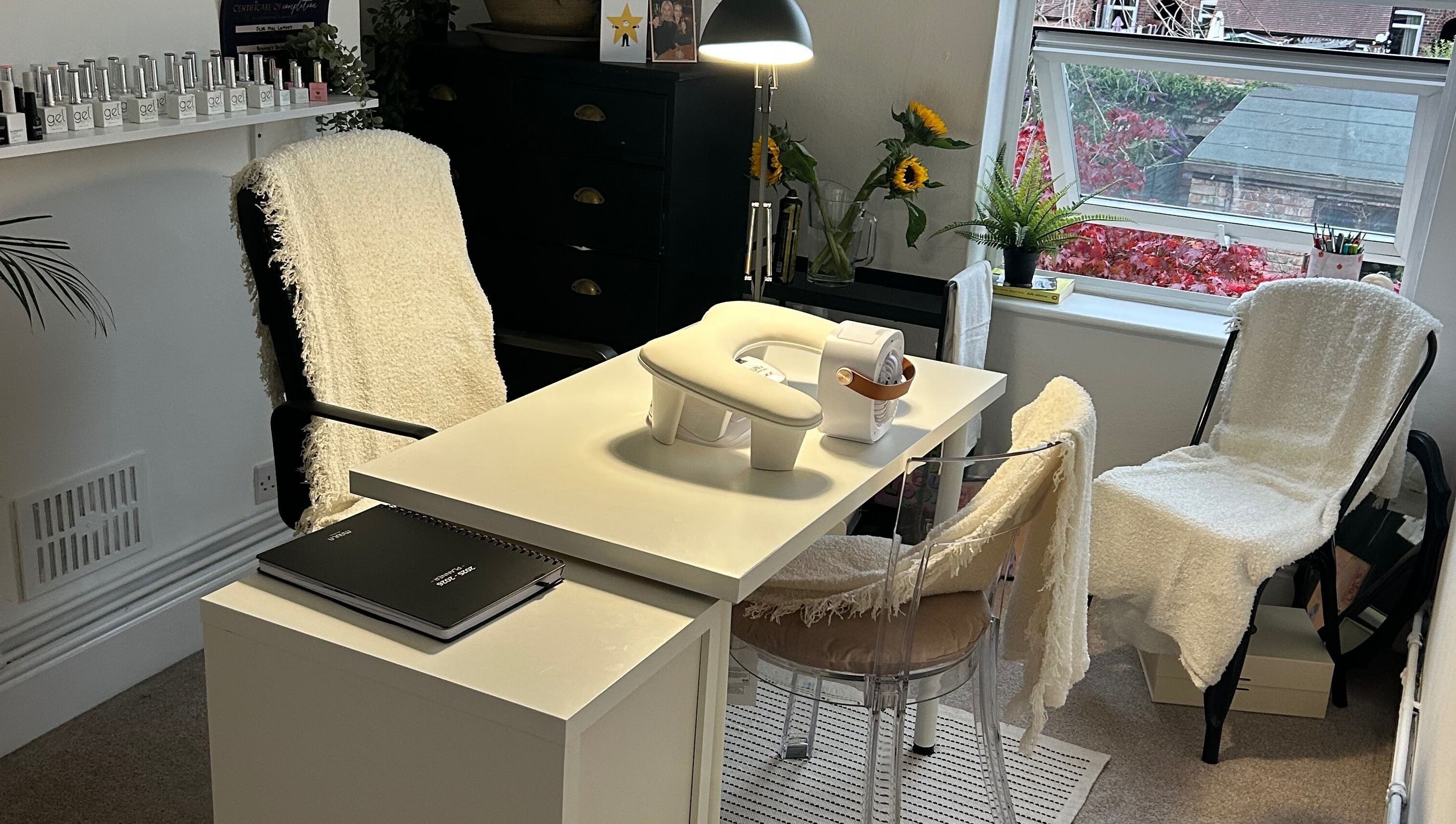 Bright nail station at Jml Nail Lab, Derby, England, GB with sunlight and modern decor.