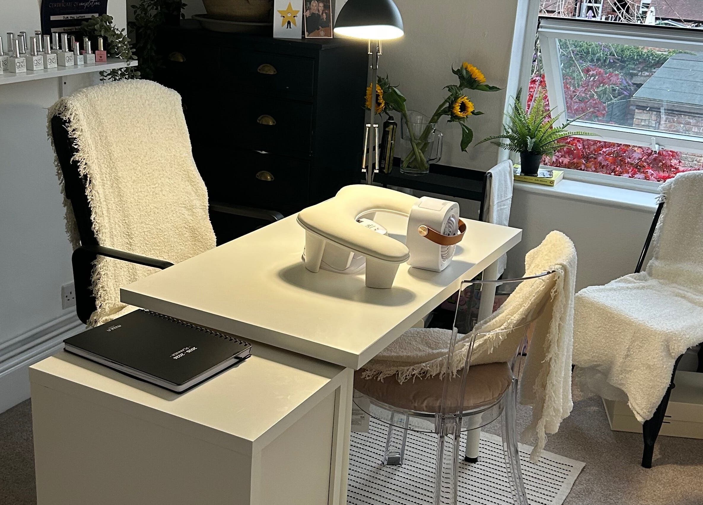Bright nail station at Jml Nail Lab, Derby, England, GB with sunlight and modern decor.