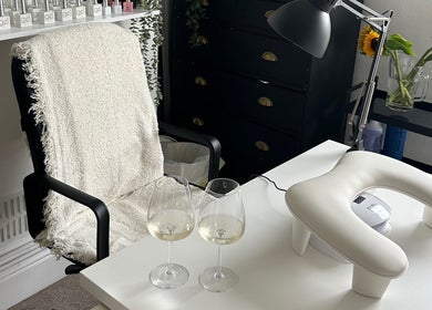 Comfortable nail care setup at Jml Nail Lab, Derby, England, GB, with tools and sunflowers.