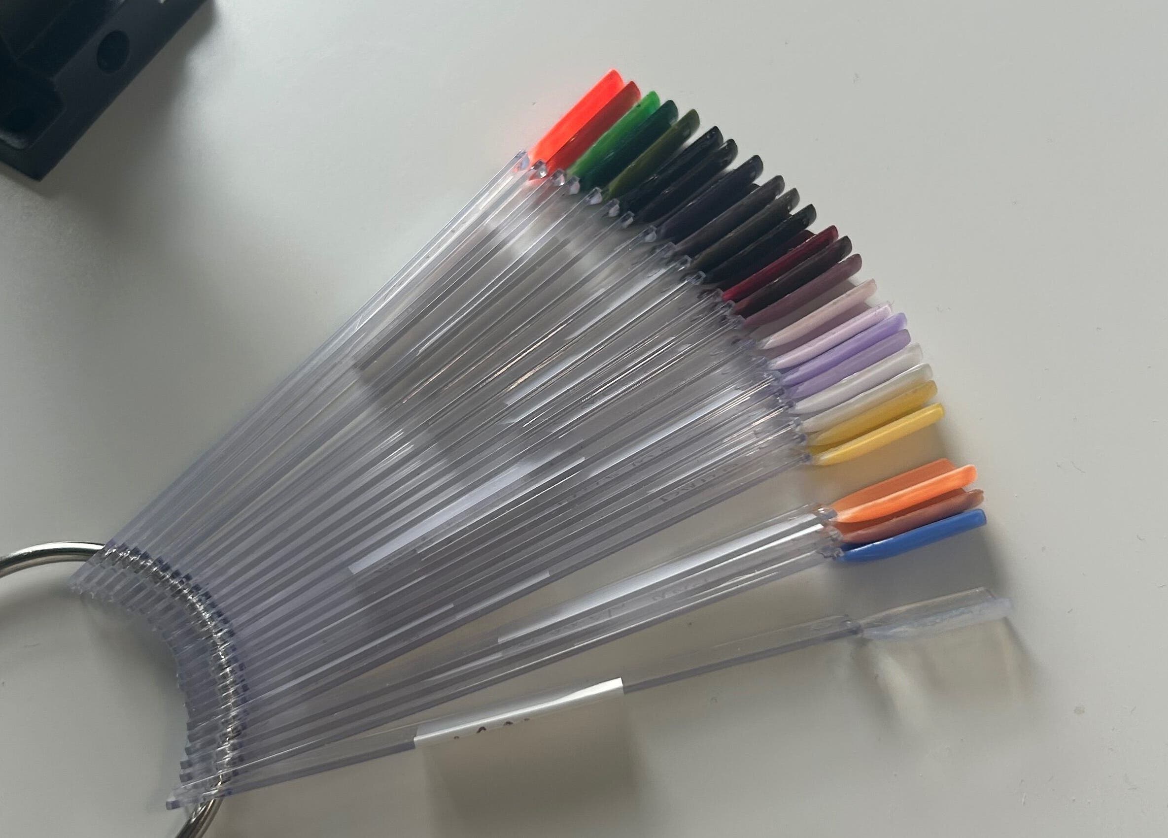 Nail color sample fan at Jml Nail Lab, Derby, England, GB offering diverse shades.