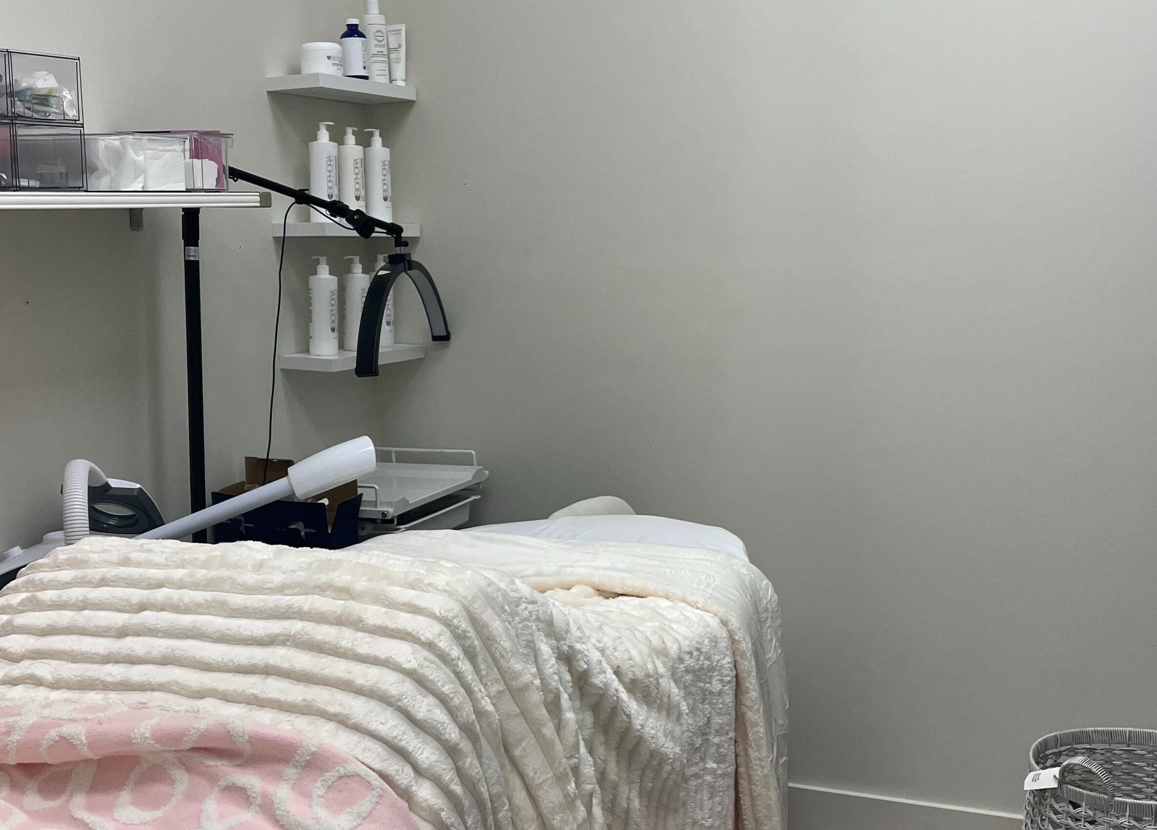 Relaxing treatment room at Glow Essence Beauty in Vaughan, Ontario, CA equipped for skincare therapies.
