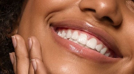 Close-up of a smiling person at Avn Aesthetics, Oshawa, Ontario, CA showcasing bright, healthy teeth.