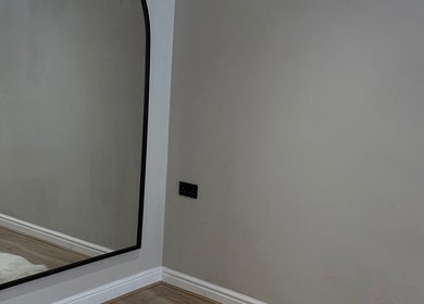Sleek wall mirror at Queen B Beauty, Newhaven, England, GB, enhancing modern decor.