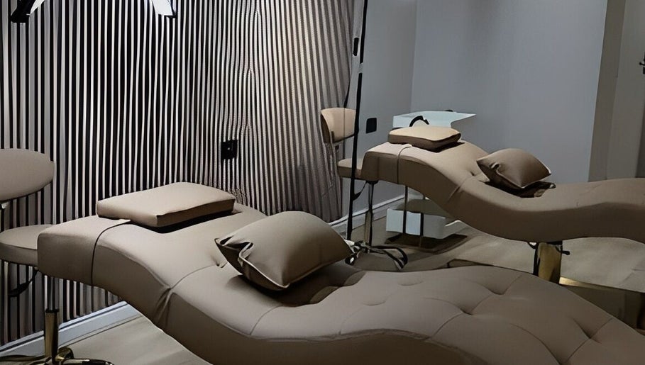 Elegant treatment beds at Queen B Beauty, Newhaven, England, GB, set in a serene spa atmosphere.