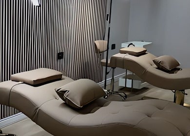 Elegant treatment beds at Queen B Beauty, Newhaven, England, GB, set in a serene spa atmosphere.