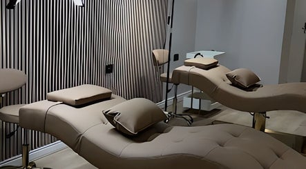 Elegant treatment beds at Queen B Beauty, Newhaven, England, GB, set in a serene spa atmosphere.