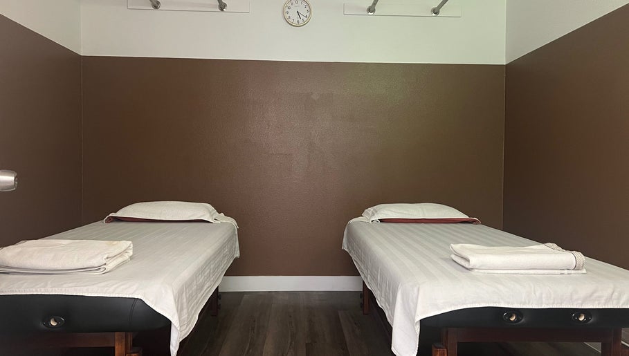 Tranquil massage room at Healthy Life Spa & massage, Las Vegas, Nevada, US with two massage tables and soft lighting.