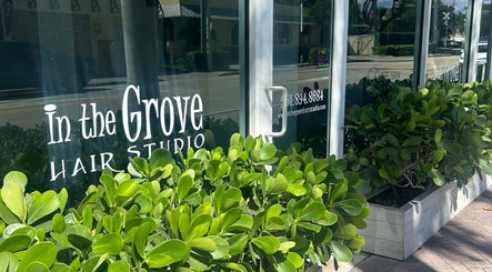 Entrance of In the Grove Hair Studio, home to Bristol Haircare, Delray Beach, Florida with lush greenery.