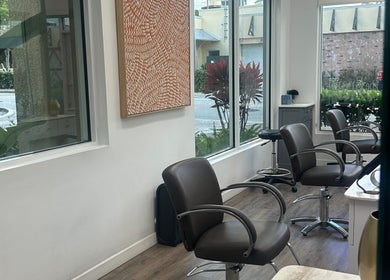 Stylish salon interior with modern chairs at Bristol Haircare, Delray Beach, Florida, US.