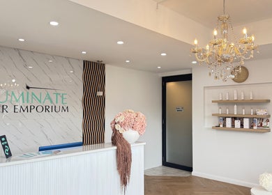 Elegant reception area of illuminate Laser Emporium in Melbourne, Victoria, AU featuring chic decor and lighting.