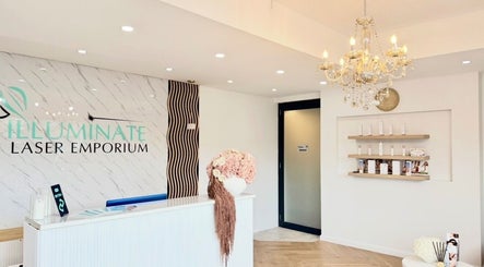 Chic reception at illuminate Laser Emporium, Melbourne, Victoria, AU with chandelier and floral decor.