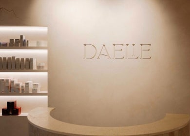 Reception area at Brows and Needle, Freshwater, New South Wales, AU, with sleek shelves of beauty products.