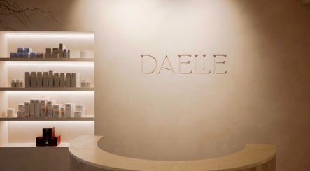 Reception area at Brows and Needle, Freshwater, New South Wales, AU, with sleek shelves of beauty products.