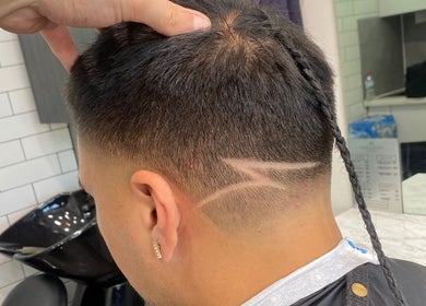 Modern buzzcut with unique design at Hair Tech Lounge, Munno Para, South Australia, AU.