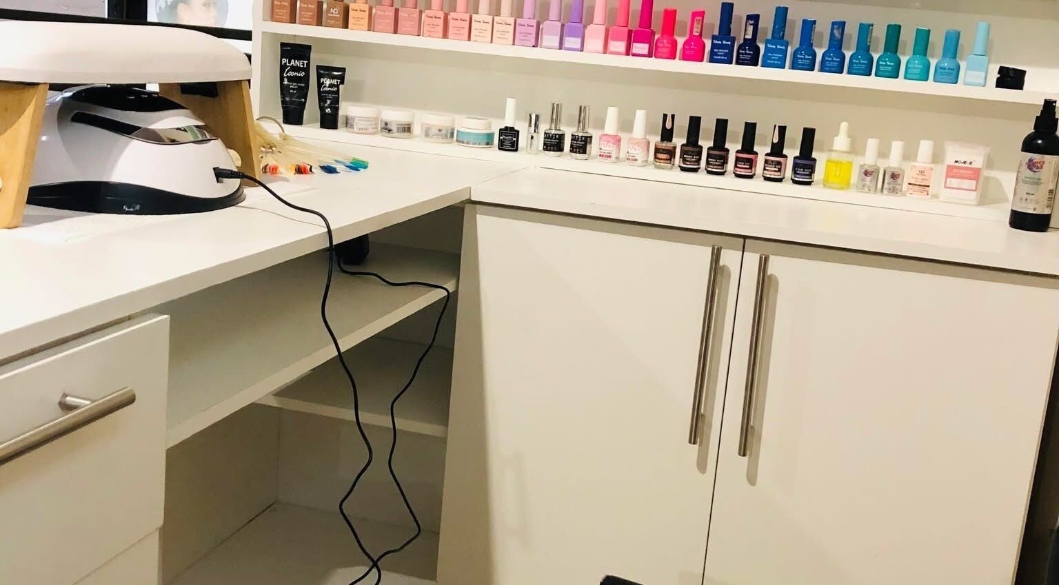 NailedbyStheM nail polish and manicure tools neatly arranged in Soweto, Gauteng, ZA salon.