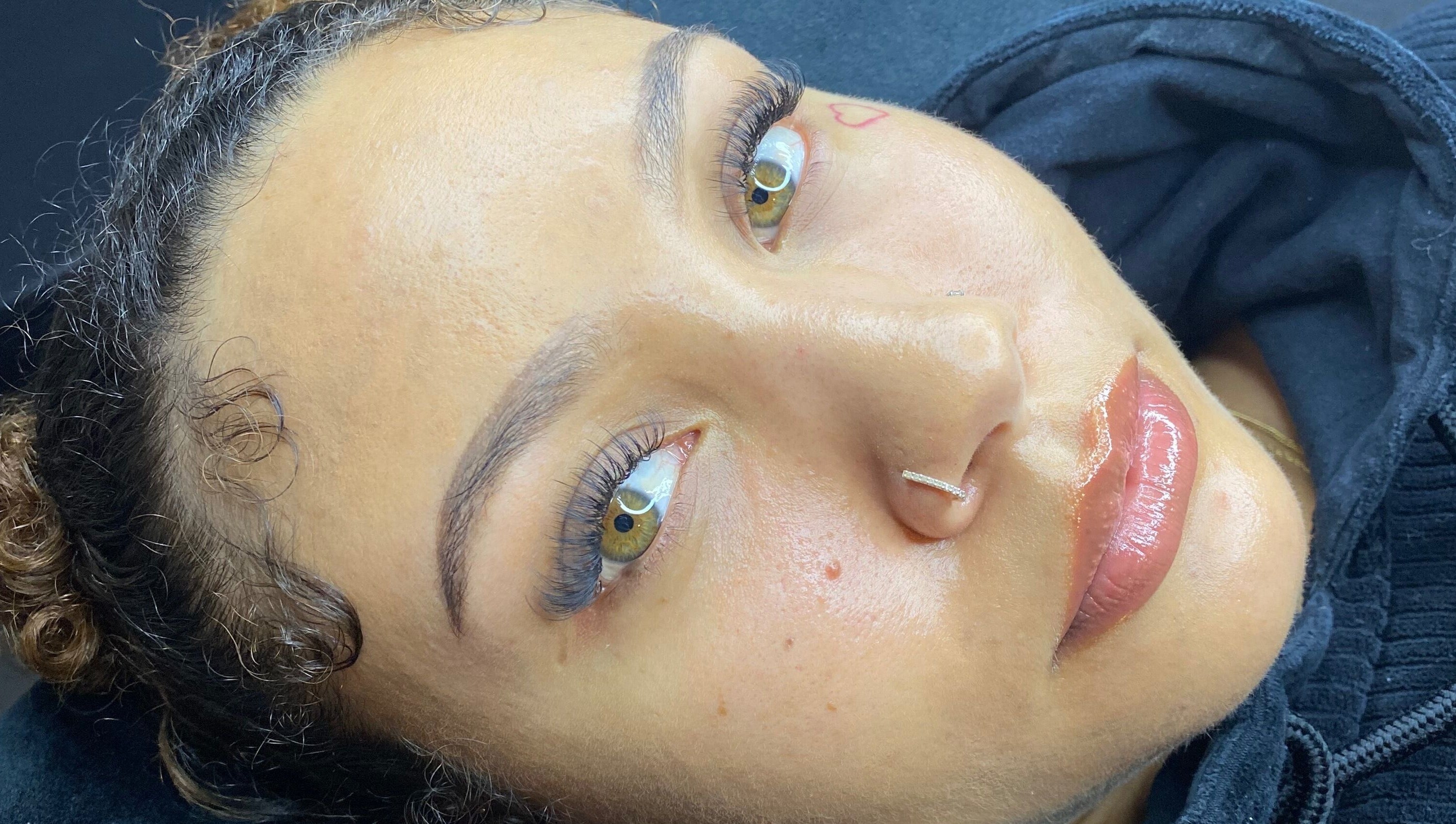 Close-up of a client's flawless skin and lashes at The Scorpio Effect, Auckland, Auckland, NZ.