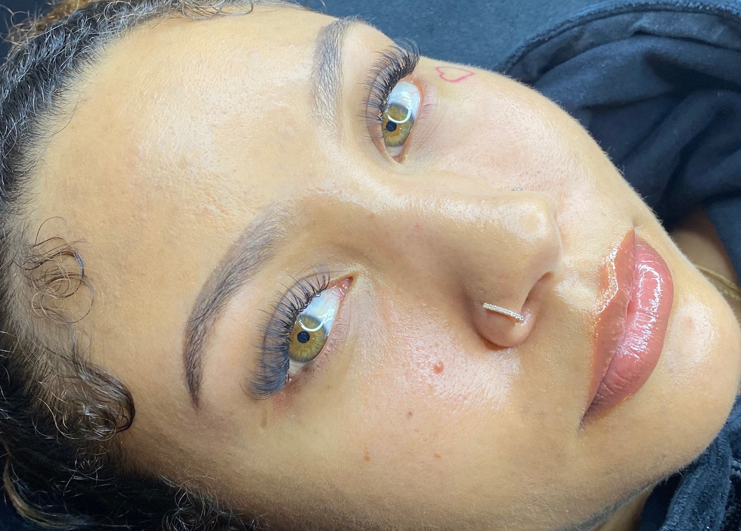 Close-up of a client's flawless skin and lashes at The Scorpio Effect, Auckland, Auckland, NZ.