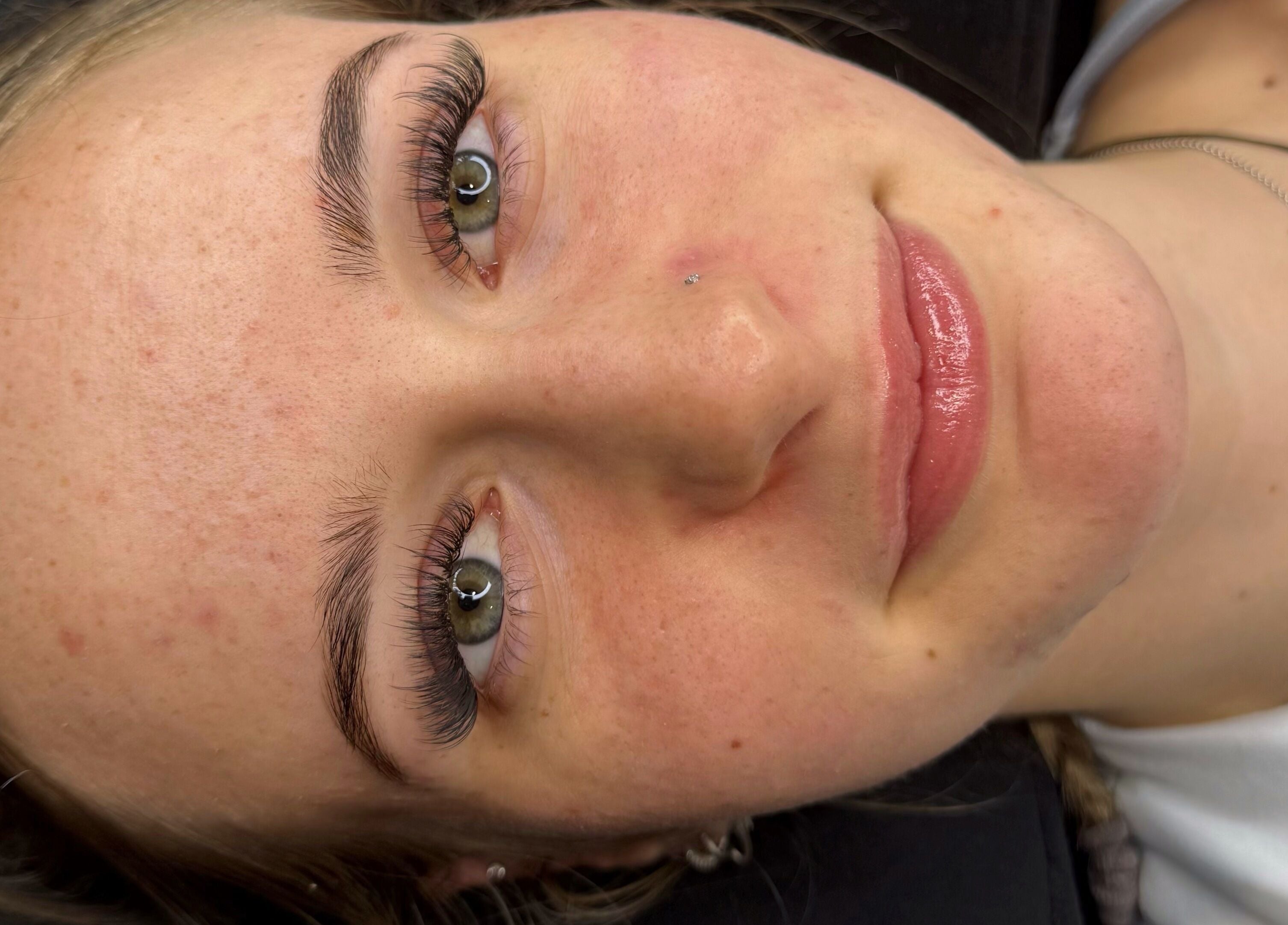 Youthful face with smooth skin and glossy lips at The Scorpio Effect, Auckland, Auckland, NZ.