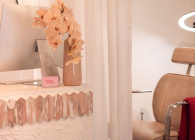 Elegant Finish Beauty interior with chair and floral decor in Paddington, Queensland, AU.