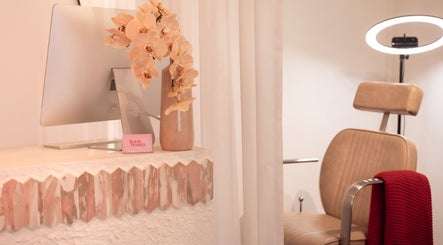 Elegant Finish Beauty interior with chair and floral decor in Paddington, Queensland, AU.