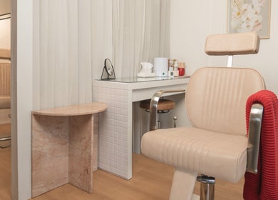 Cozy beauty station at Finish Beauty, Paddington, Queensland, AU with plush chairs and modern decor.