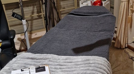 Cozy treatment room at Steph Beauty Salon in Dianella, Western Australia, AU, featuring a plush massage bed.