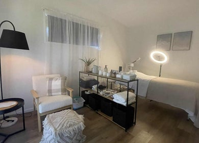Serene spa room at ManUnwind - The Man Spa, Little Mountain, Queensland, AU, featuring modern decor and massage bed.