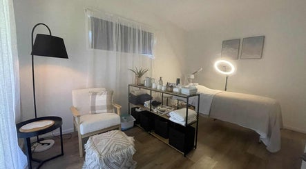 Serene spa room at ManUnwind - The Man Spa, Little Mountain, Queensland, AU, featuring modern decor and massage bed.