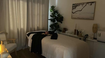 Relaxing spa room at ManUnwind - The Man Spa in Little Mountain, Queensland, AU, offering serene ambiance.