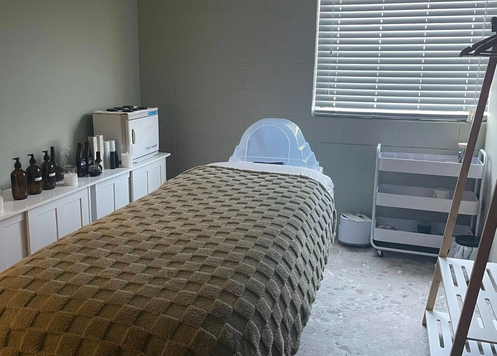 Comfortable treatment room at Viktor - Men's Grooming Lounge, Caloundra, Queensland, AU, with plush bed and products.