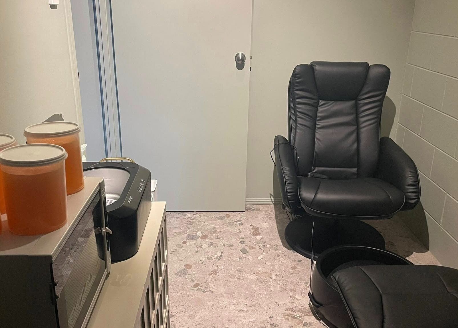 Cozy grooming room at Viktor - Men's Grooming Lounge, Caloundra, Queensland with sleek chairs and warm ambiance.