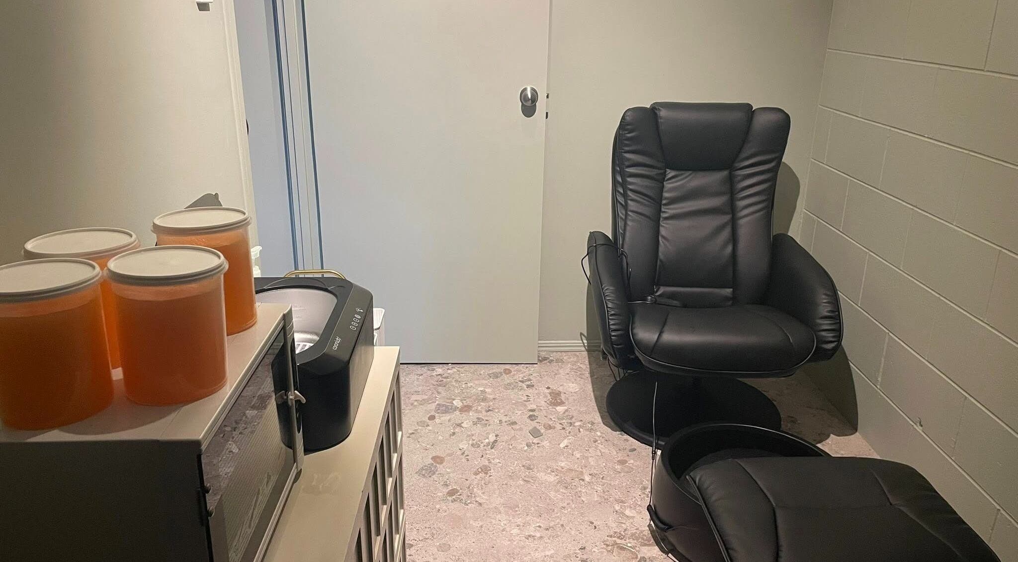 Relax in the cozy grooming room at Viktor - Men's Grooming Lounge, Caloundra, Queensland, AU with plush seating.