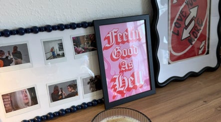 Artistic photo display and framed quote at SHADE TWENTY2, Wolverhampton, England, GB.