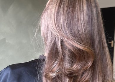 Glossy hair styling at SHADE TWENTY2, Wolverhampton, England, GB showcasing soft and elegant waves.