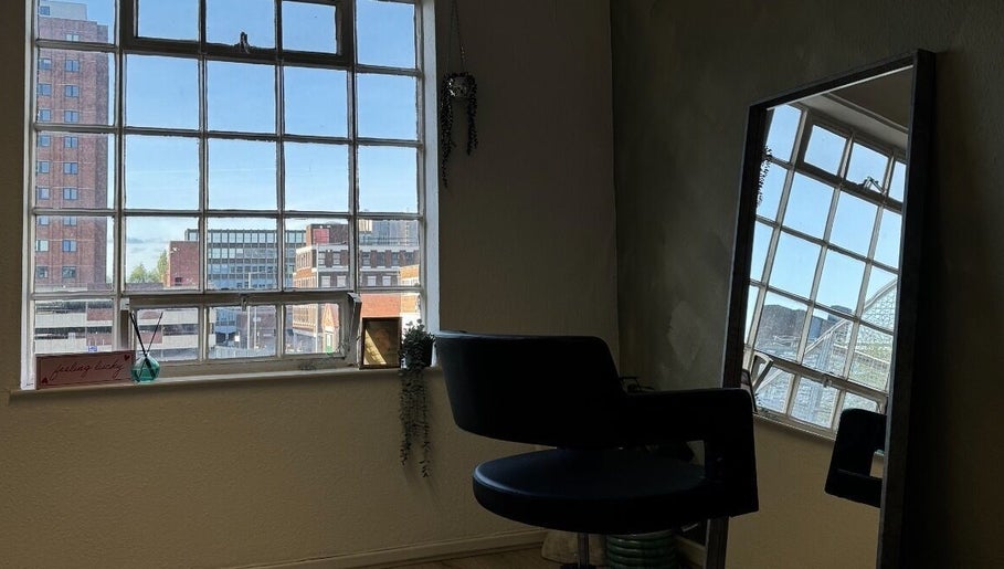 Chic interior at Studio Shade Wlv, city views through large windows in Wolverhampton, England, GB.