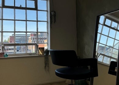 Chic interior at Studio Shade Wlv, city views through large windows in Wolverhampton, England, GB.