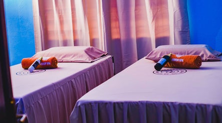 Relaxing massage room at Anasa Spa & Wellness, Ogbodjo, Greater Accra Region, GH, featuring cozy beds and soft lighting.