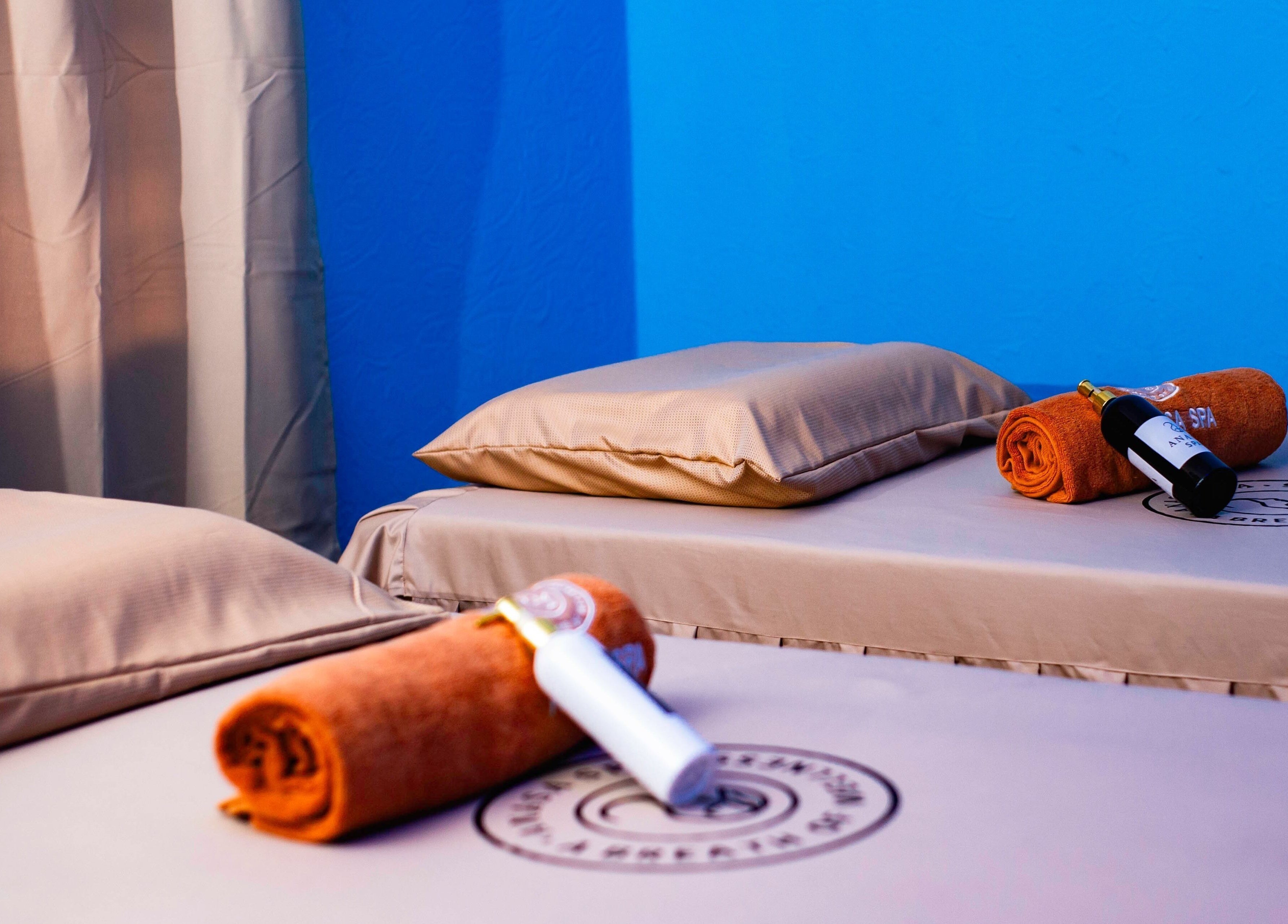 Serene spa room at Anasa Spa & Wellness in Ogbodjo, Greater Accra featuring two massage beds with essentials.