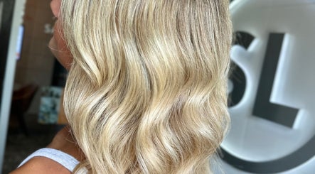 Close-up of wavy blonde hair at SDZ Hair Loft, Dublin, Ohio, US. Elegant styling and shine.