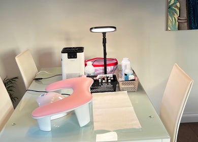 Nail station at Balkan Glam Nails, London, England, GB showcasing manicure tools and decor.