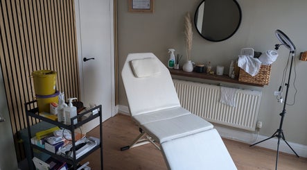 Treatment room at Recentre Aesthetics in Stockport, England, GB, featuring a modern treatment chair.