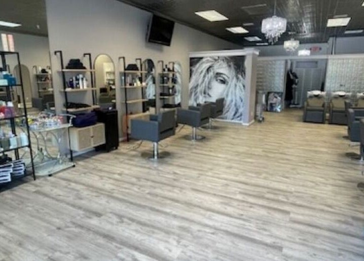 Modern interior of On the Avenue Salon in Norwalk, Connecticut, US with stylish chairs and decor.