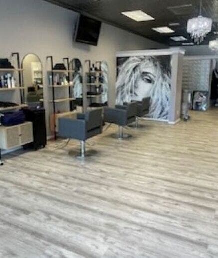 Modern interior of On the Avenue Salon in Norwalk, Connecticut, US with stylish chairs and decor.