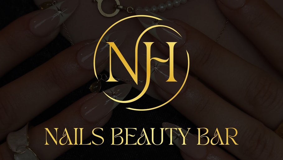 NH NAILS BEAUTY BAR logo over stylish nails in Rosebery, New South Wales, AU.