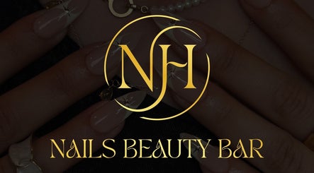 NH NAILS BEAUTY BAR logo over stylish nails in Rosebery, New South Wales, AU.
